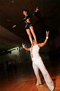 Georgia Ambarian Standing On Eric Luna's Shoulders