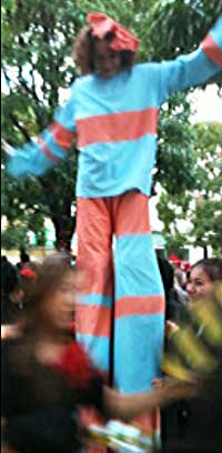 Stilt Performer in a Crowd