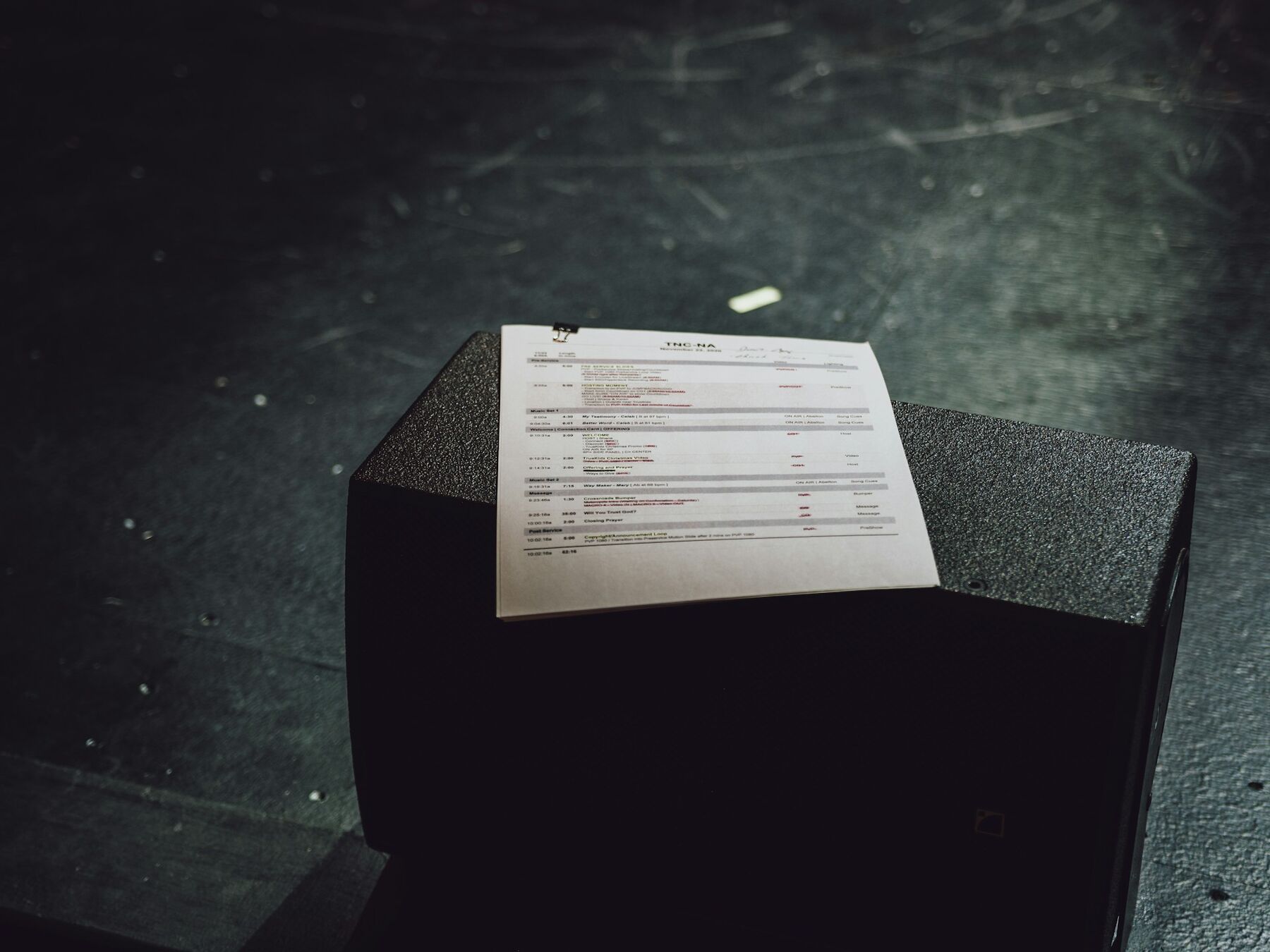 A black box with a sheet of paper resting on top