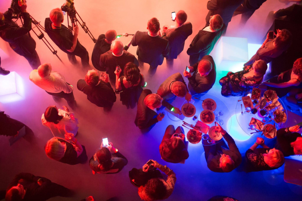 Corporate event Party band performing the best party band songs live as crowd dances near the stage