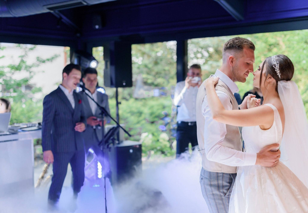 Wedding music band A couple having their first dance with a live music band