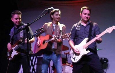 Wildwood Country Band performing live country music at an event